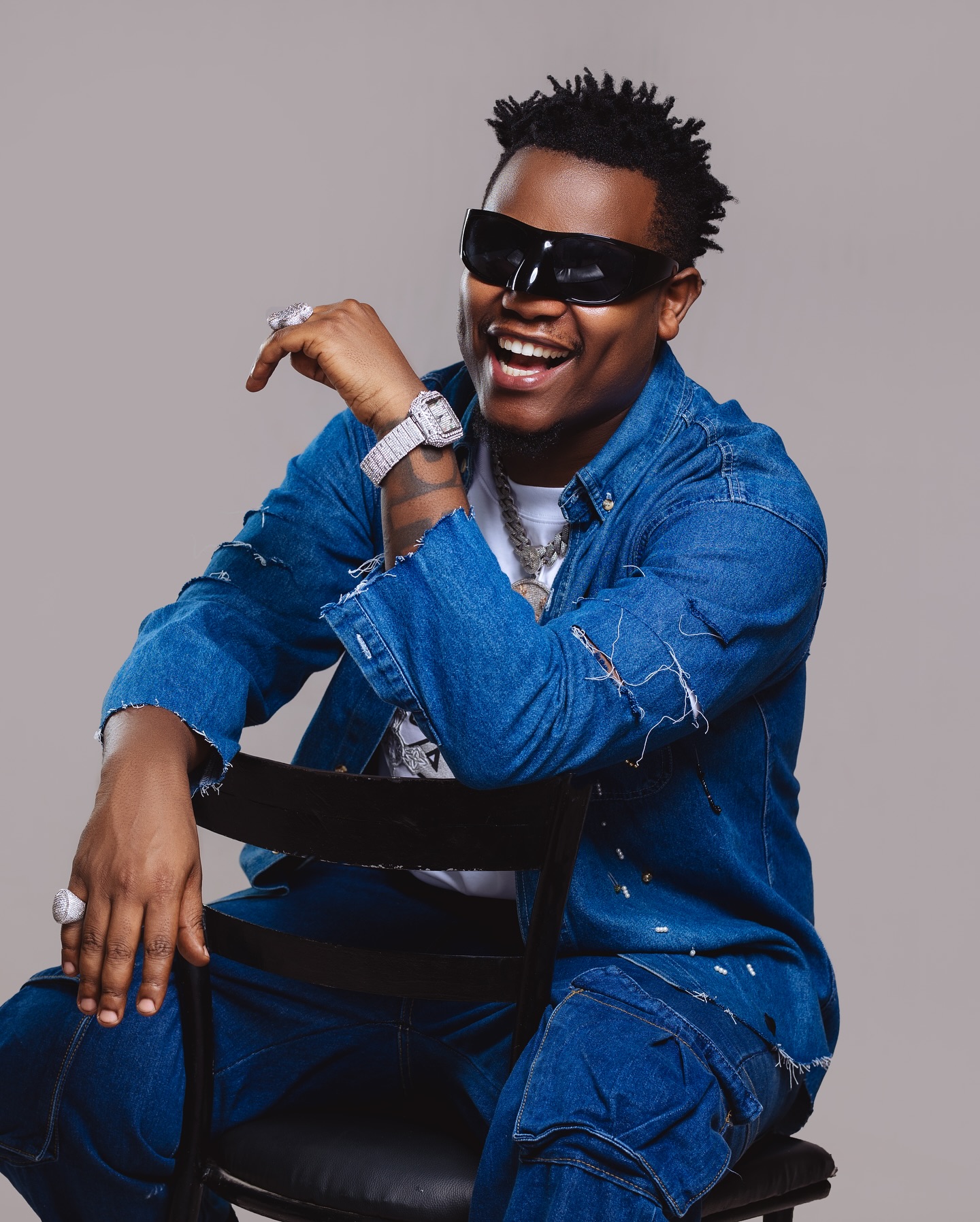 Bruce Melodie blends Afrobeat, R&B, and Rwandan sounds to rise as a top East African artist, with hits like "Abanyakigali" and a passion for youth empowerment.